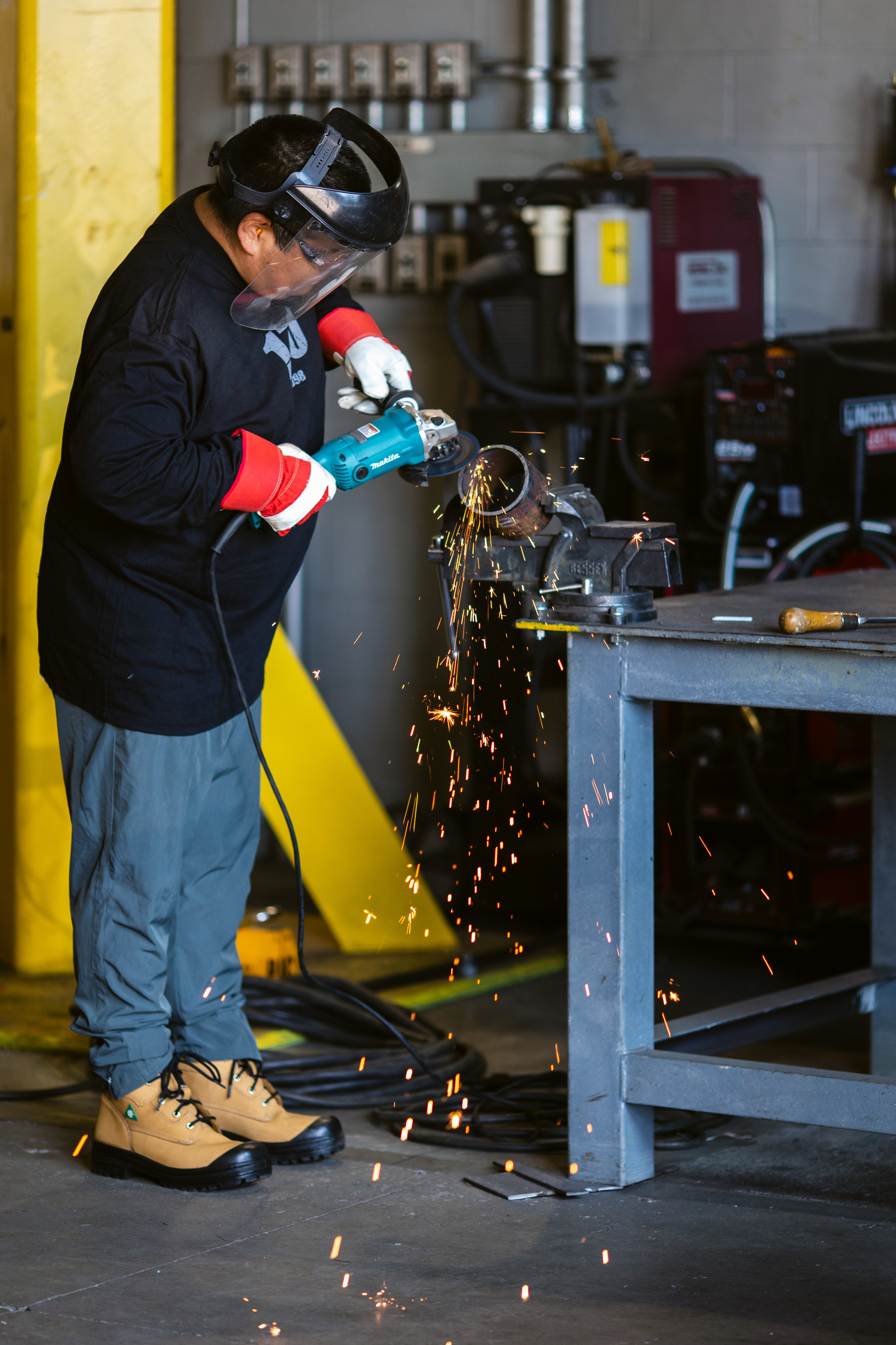 man working on a dremel