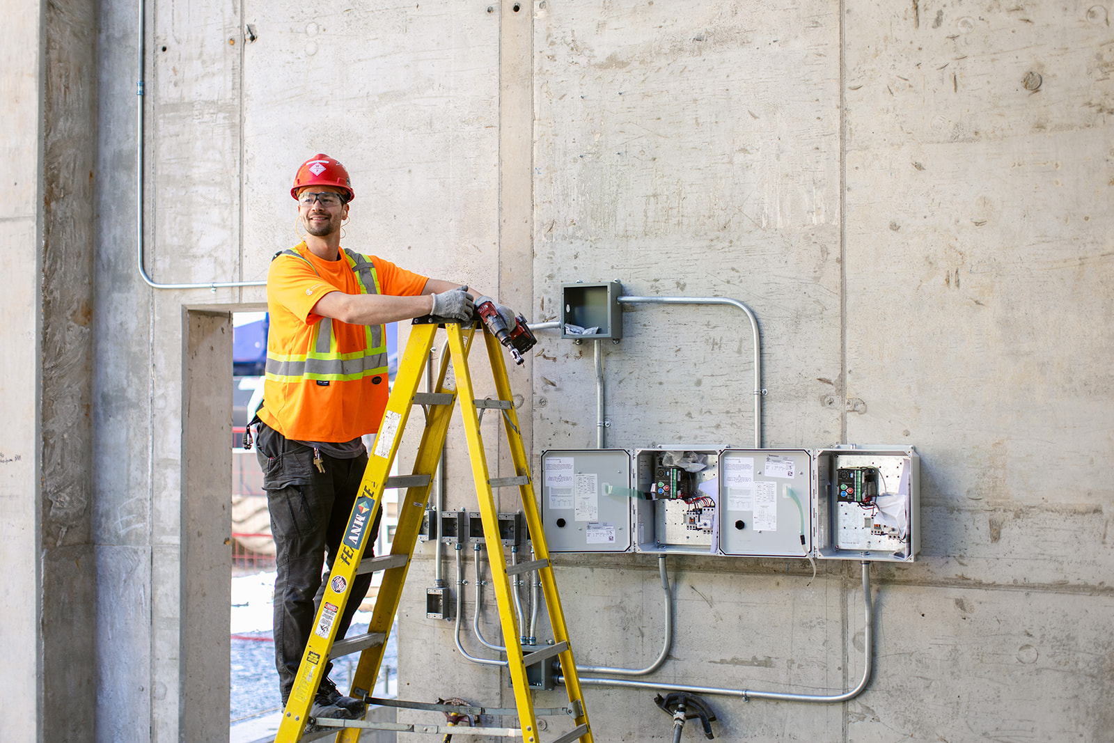 man standing on ladder in building
