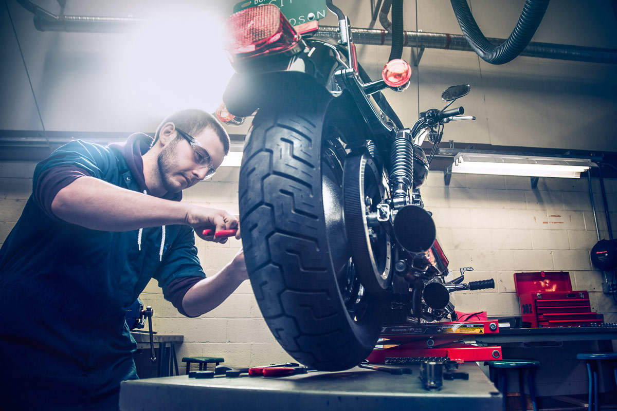 Motorcycle Mechanic with bike